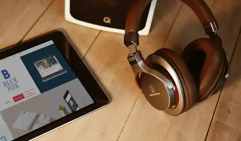 iPad and headphones on a desk