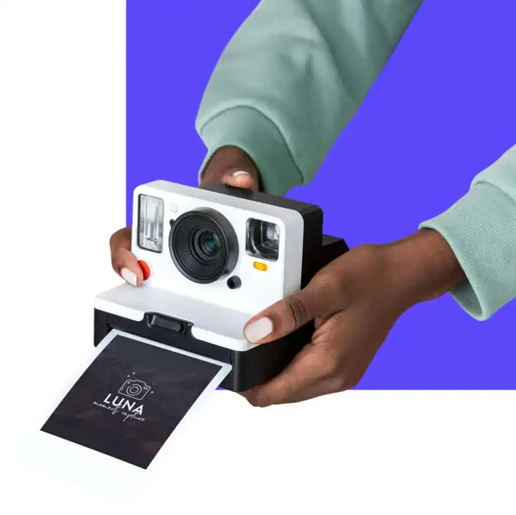 Man holding polaroid camera