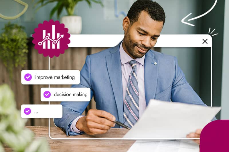 black man in suit reading paper