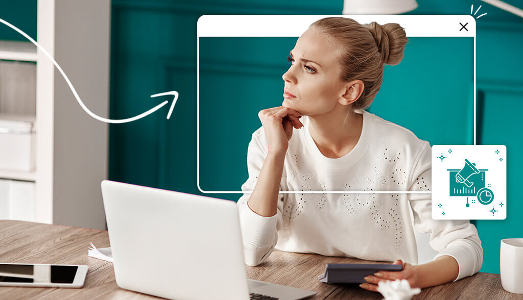 woman thinking in front of laptop