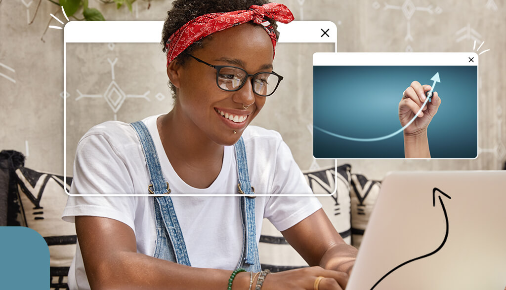african american woman smiling in front of laptop