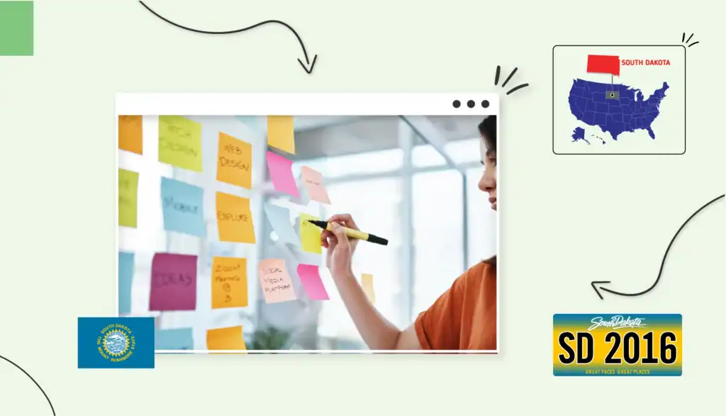 Small business owner writing on a blue sticky note that is surrounded by other colourful sticky notes on a wall in South Dakota