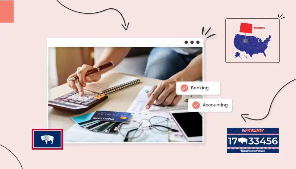 Small business owner using a calculator and looking at a spreadsheet with credit cards fanned out on the table in Wyoming