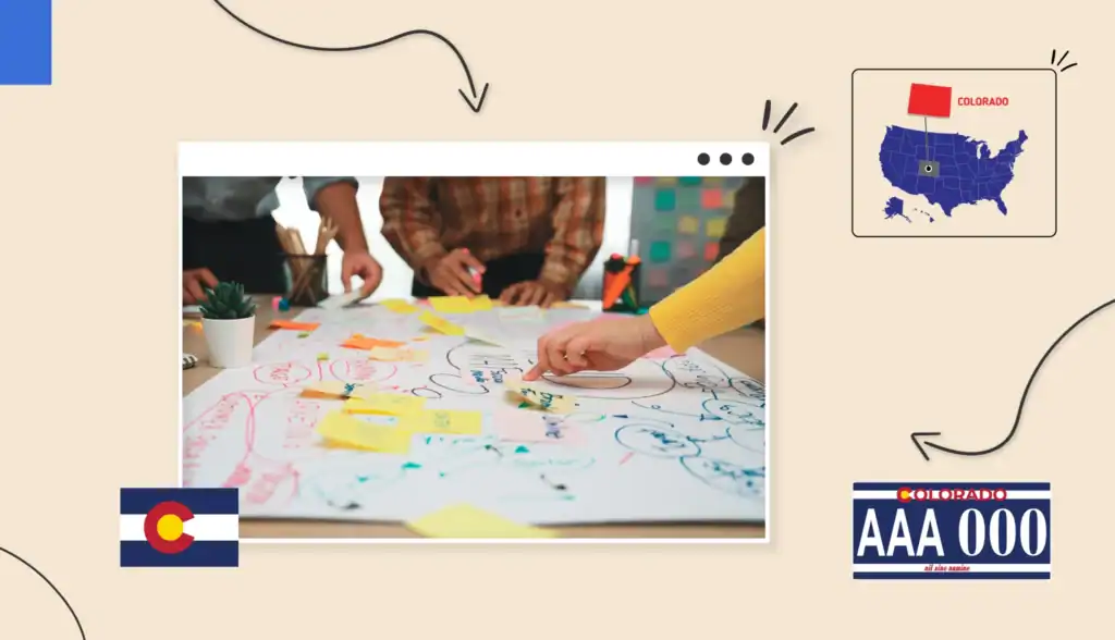 Small business owners standing around a table writing on sticky notes in Colorado