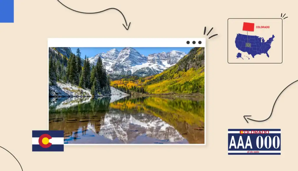 Scenic view of a reflective lake in Colorado surrounded by snow-capped mountains and green forestry. 