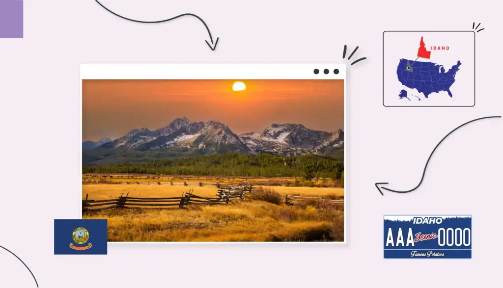 Scenic view of a grassy, fenced field with mountains and a sunset in the background in Idaho