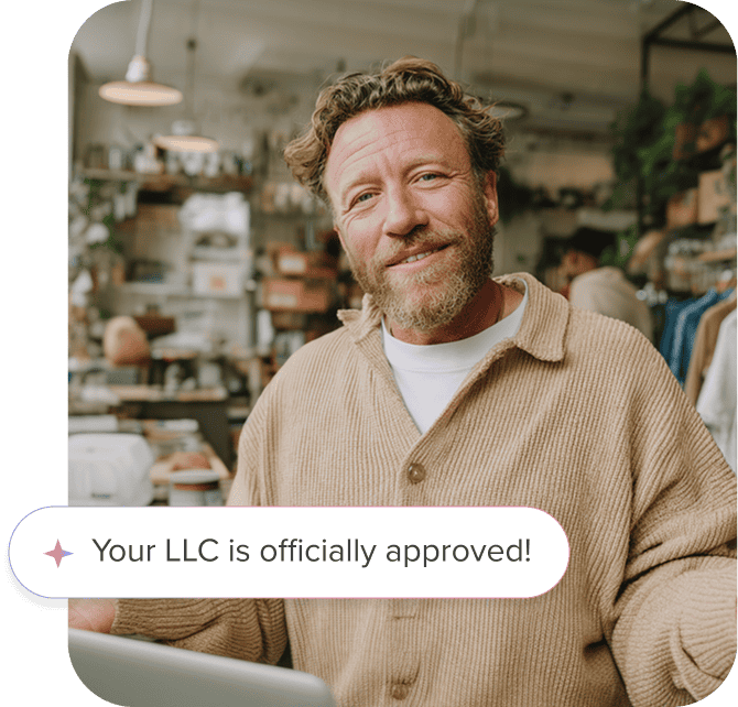 Business man smiling after submitting an LLC
