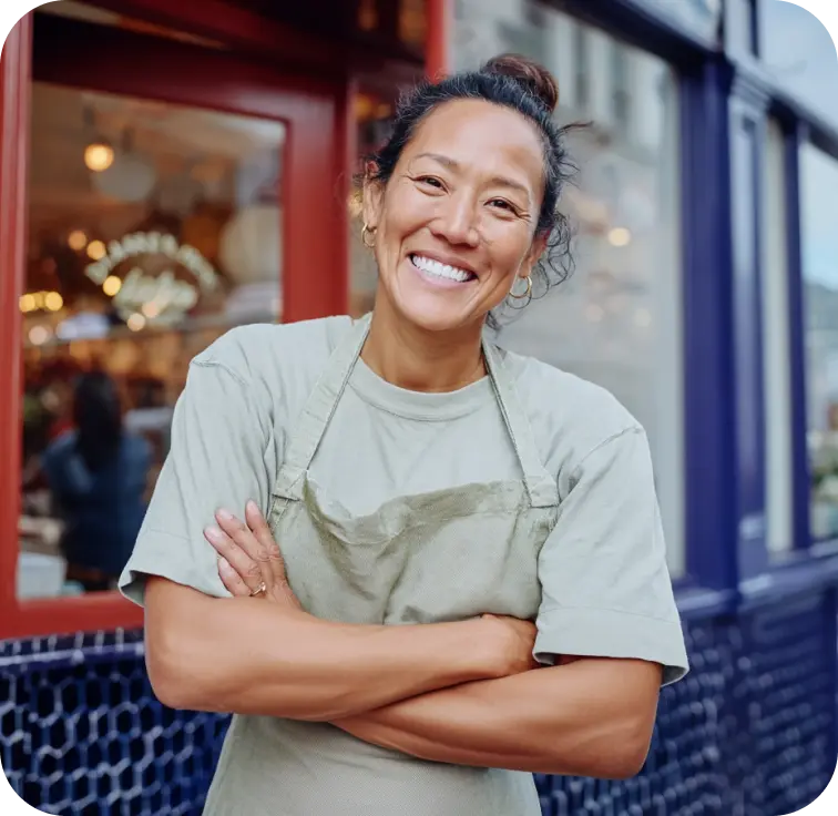 business woman smiling after using Tailor Brands to start her business