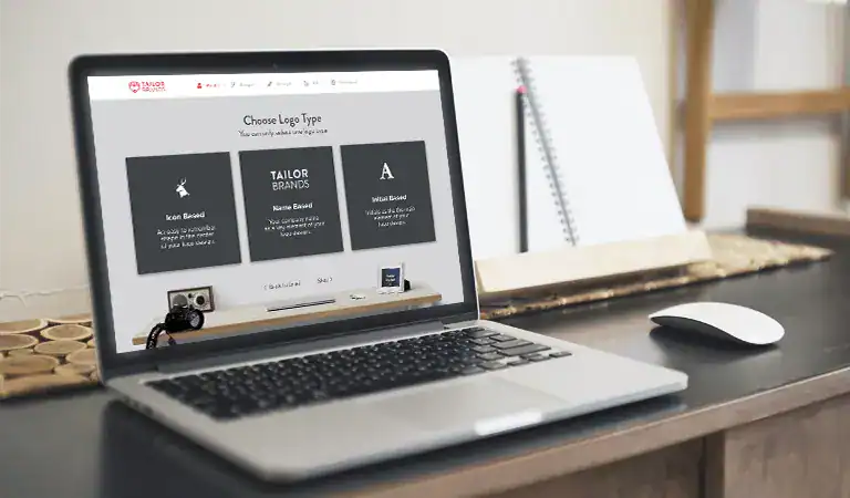 Laptop with tailor brands website